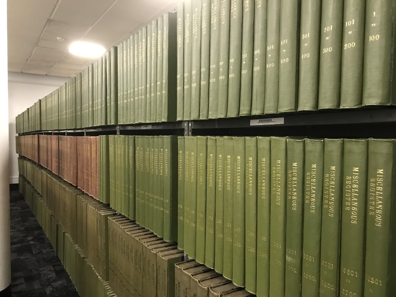 Shelves full of miscellaneous registers books